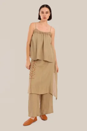 Pants with an embroidered asymmetric skirt