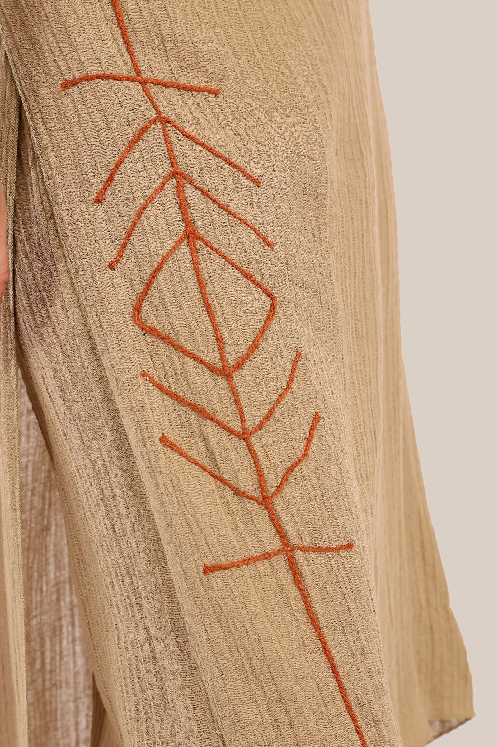 Pants with an embroidered asymmetric skirt