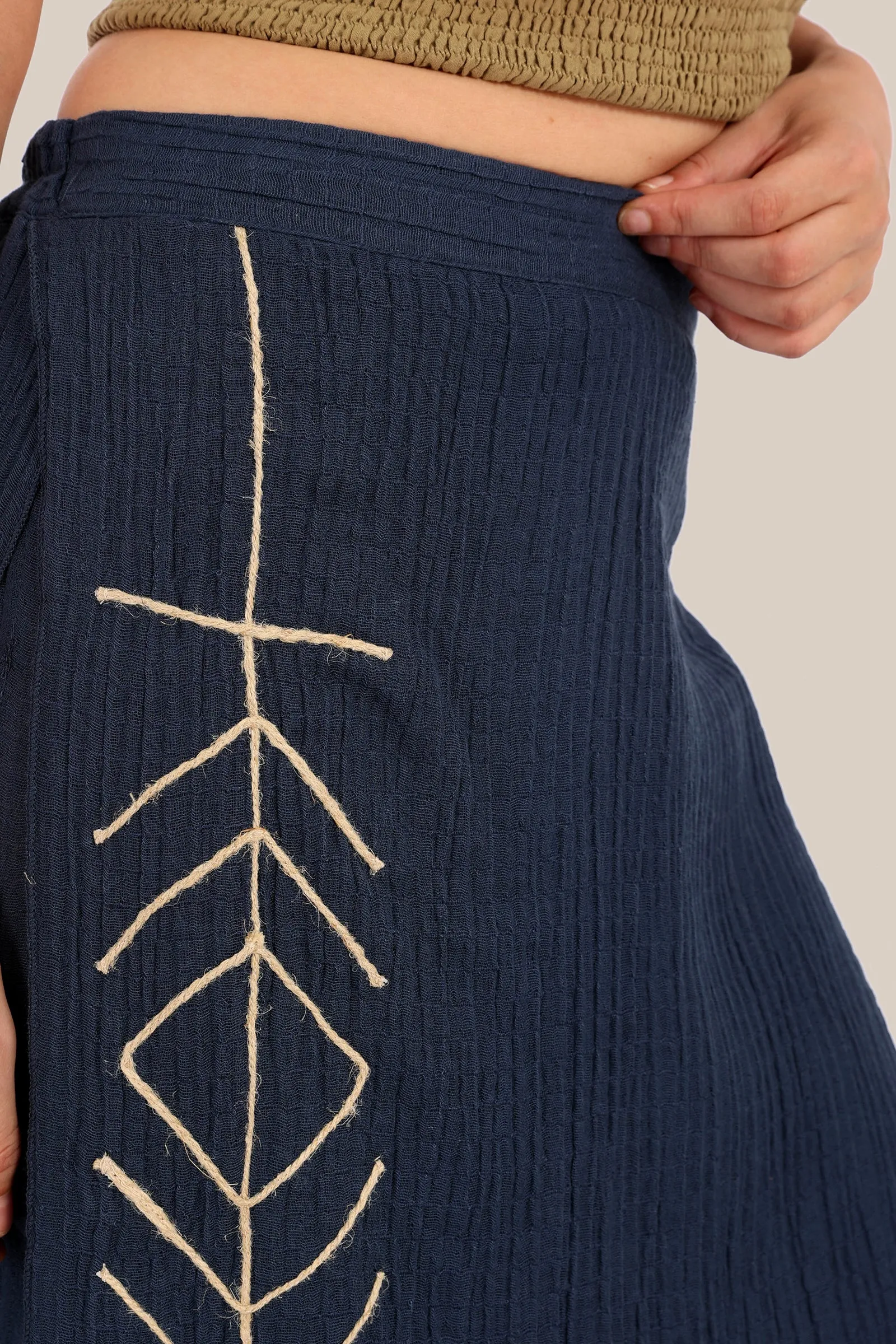 Pants with an embroidered asymmetric skirt