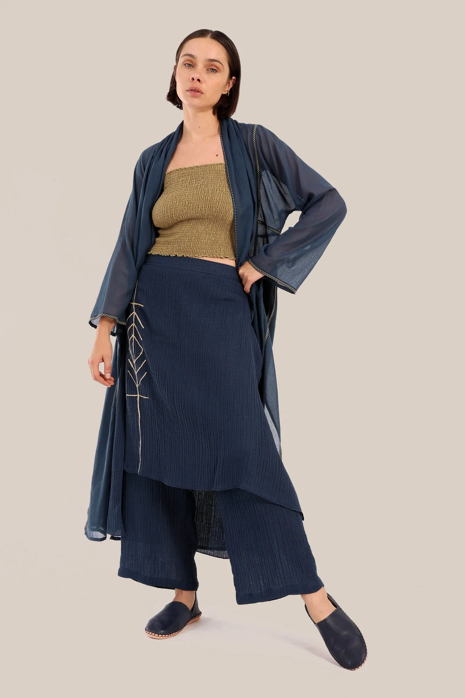 Pants with an embroidered asymmetric skirt