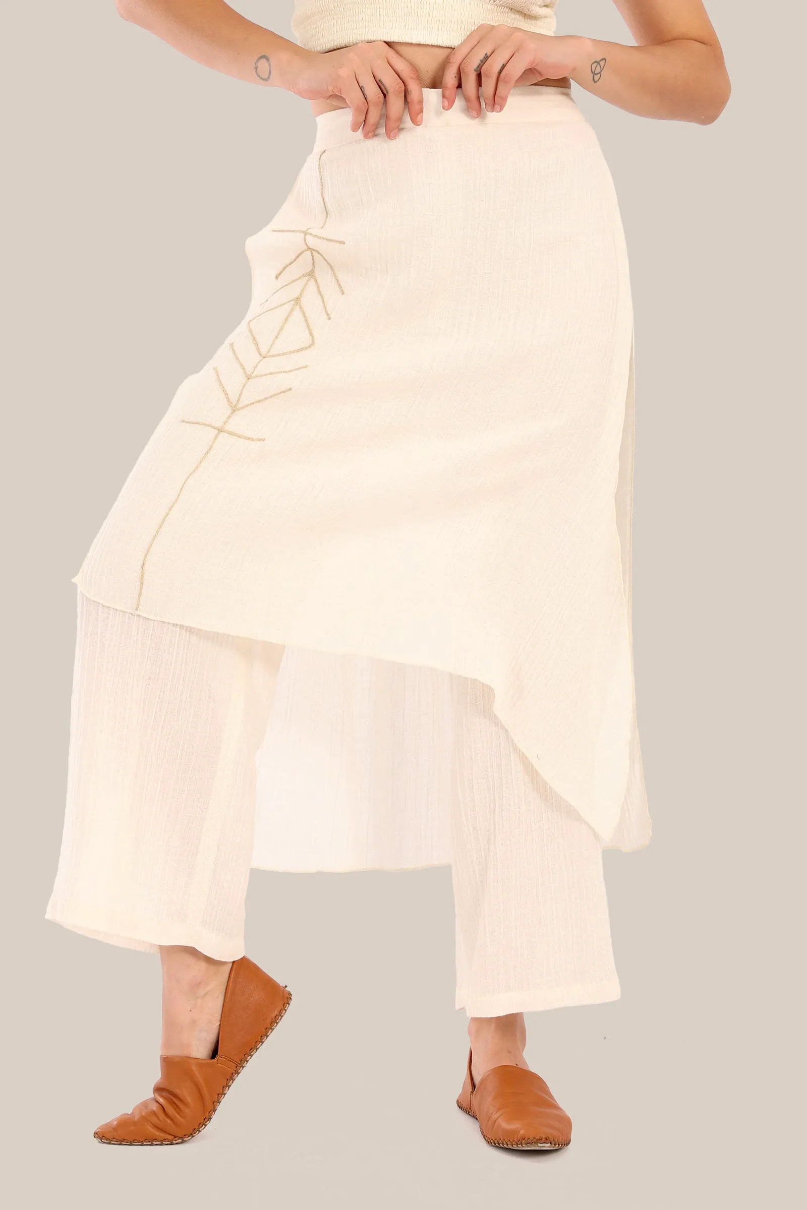 Pants with an embroidered asymmetric skirt